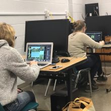 Students processing digital photographs in wildlife computer photography lab 