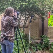 Kelly Wood photographing hummingbirds in Wildlife Photography class